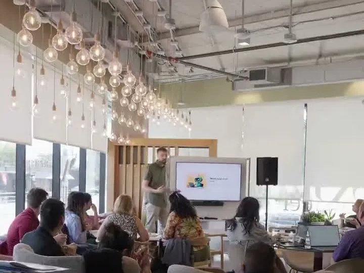 A speaker presenting to a seated room at Grow with Nalo Seed in September